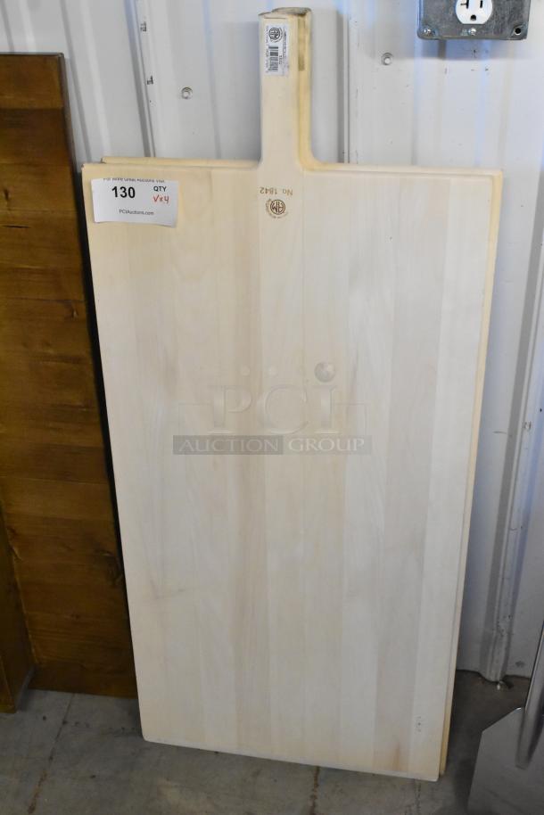 New American Metalcraft 18"x42" wood pizza peel with 6.5" handle. Features label and quality stamp.