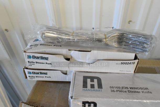 Boxes of Darling Bella dinner forks and Hansmart Windsor dinner knives, new in packaging.
