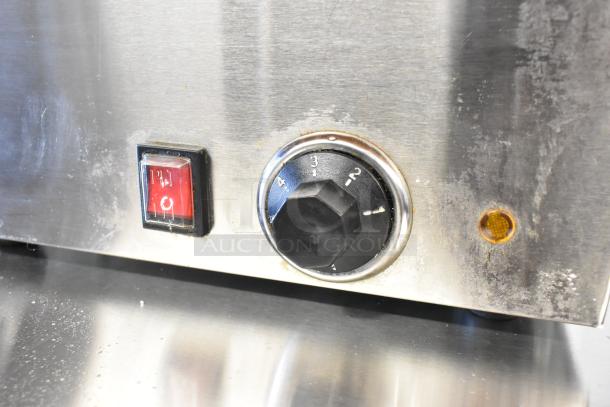 KoolMore CFW-4 stainless steel food warmer, new condition, slight scratches. Features on/off switch and temperature dial.