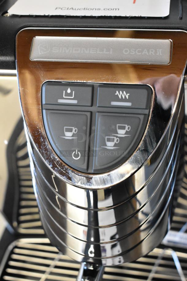BRAND NEW 2024 Nuova Simonelli OSCAR II AD Black Espresso Machine, direct connection, control panel close-up, slight scratches visible.