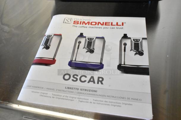 User manual for 2024 Nuova Simonelli OSCAR II AD Black Professional Espresso Machine, showing product images and brand logo.