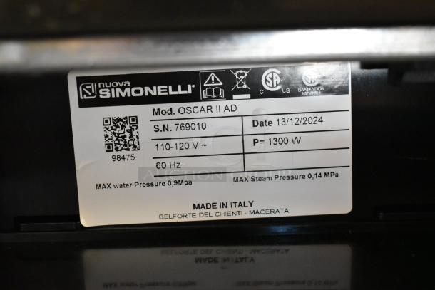 Brand label of a 2024 Nuova Simonelli OSCAR II AD Black Professional Espresso Machine. Model indicated, power: 110-120V. Made in Italy.