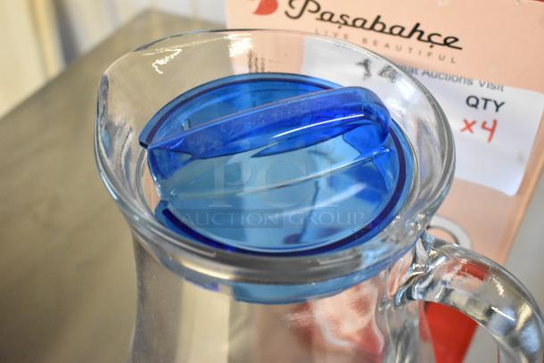 4 new Pasabahce Bistro 61 oz. glass pitchers from Steelite, slight scratches and dents, blue lid, quantity 4 per bid.