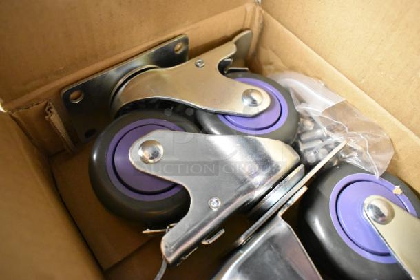 Lot of 4 commercial casters, purple wheels, metal brackets in box. New, minor scratches; includes screws.