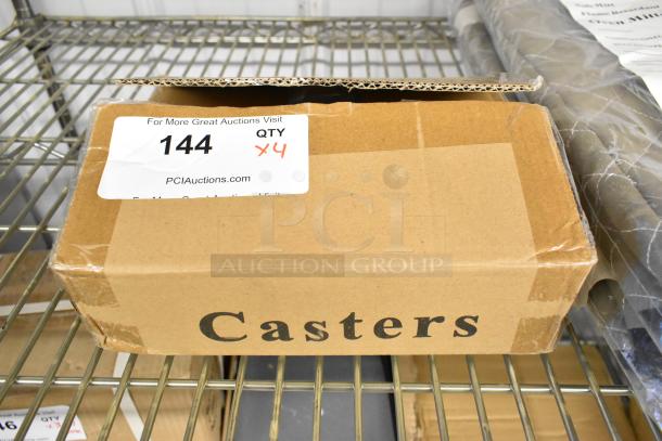Lot of 4 brand new commercial casters in original box labeled "Casters"; box shows some dents.