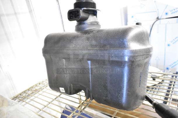 Brand new Flushmate M-101526-F3-A 503 Series 1.6 GPF replacement system, visible scratches, on metal rack.