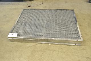 Four brand new metal filters, slightly scratched and dented, stacked with inspection tag showing quantity as four.