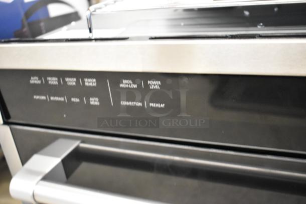Brand new KoolMore KM-CWO24-SS stainless steel convection oven with microwave. Visible controls for auto defrost, power level. Scratch and dent condition.