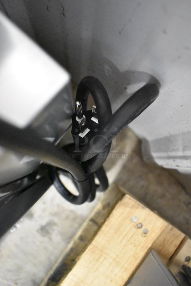 KoolMore KM-CWO24-SS convection microwave power cord looped near stainless steel casing. 120 volts, scratch and dent.