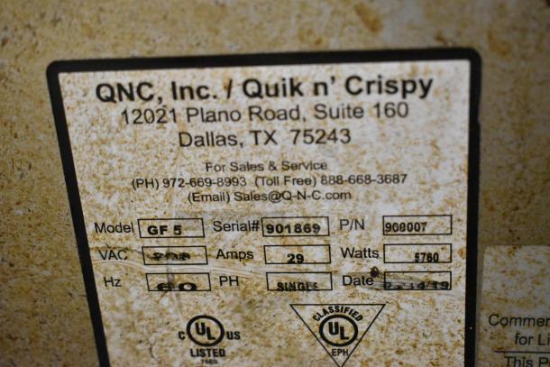 Close-up of QNC GF5 Quik N Crispy fryer label showing model, serial number 901869, 208V, 29 Amps, 5760 Watts, single phase.
