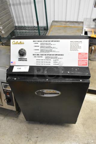 Pro Smoker N Roaster PK50PP metal commercial electric smoker, 120V, 1-phase, Cabela's operation guide displayed.