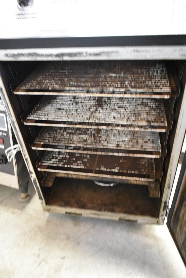 Pro Smoker N Roaster PK50PP metal commercial smoker, electric-powered, 120 volts, 1 phase, visible internal racks, used condition.