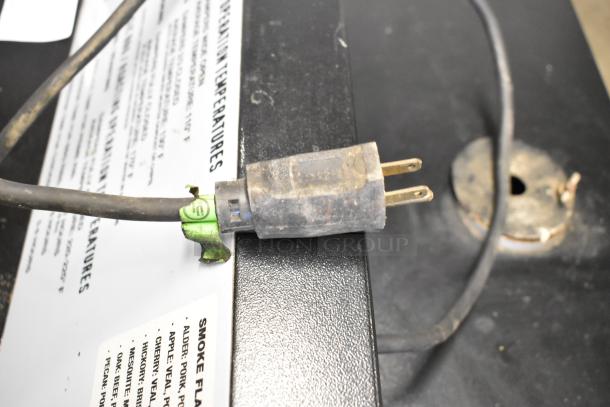 Pro Smoker N Roaster PK50PP electric smoker plug and label. 120 volts, 1 phase, commercial use, visible wear.