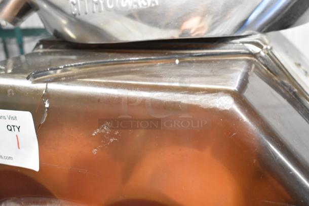 Citrocasa 8000XB citrus juicer, stainless steel, commercial floor model, 115-120V. Visible wear and scratches.