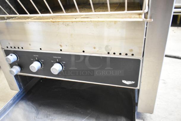 Vollrath JT3H stainless steel conveyor toaster oven, featuring control knobs for heat adjustment. 220V, 1 Phase.