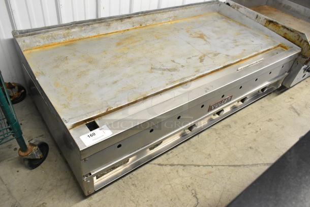 Vulcan stainless steel commercial countertop flat top griddle with visible signs of use and Vulcan branding.