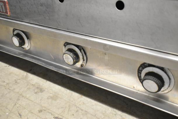 Vulcan Stainless Steel Commercial Flat Top Griddle; features front control knobs, durable construction, used condition.