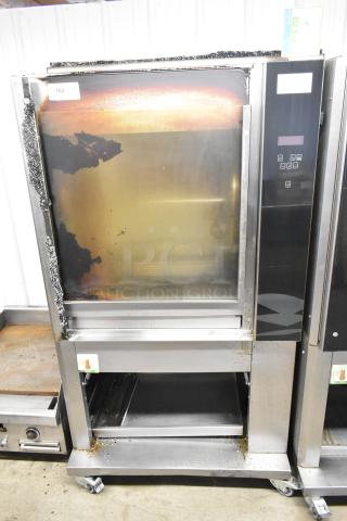 Fri-jado TDR7-P stainless steel rotisserie oven, electric, on casters, 208V, 3-phase, broken glass visible.