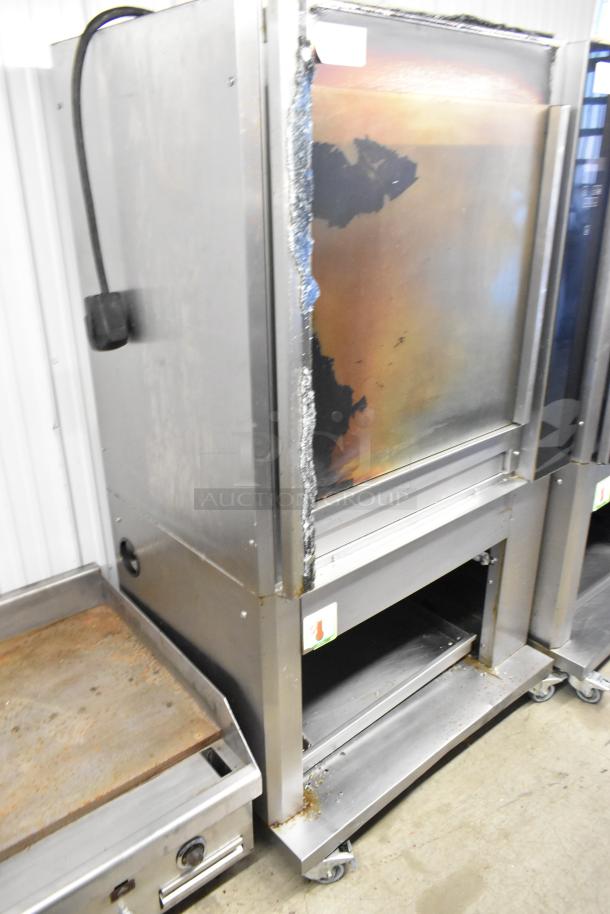 Fri-jado TDR7-P rotisserie oven, stainless steel, with broken glass. Commercial casters, 208V, 3 phase, electric powered.