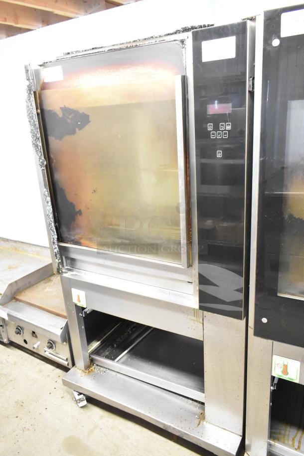 Fri-jado TDR7-P stainless steel rotisserie oven on casters. Features broken glass. 208V, 3-phase electric.