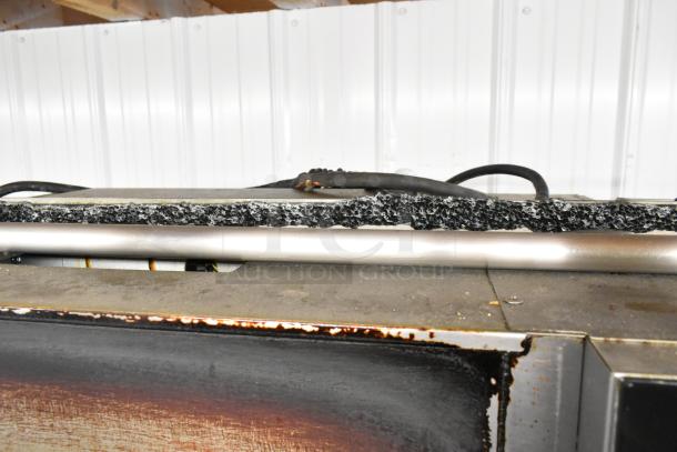 Fri-jado TDR7-P rotisserie oven with broken glass, stainless steel, electric, 208V, 3-phase, on commercial casters.