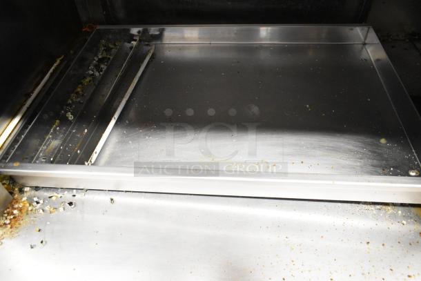 Fri-jado TDR7-P stainless steel rotisserie oven interior with broken glass, 208V, 3-phase. Visible debris and wear.