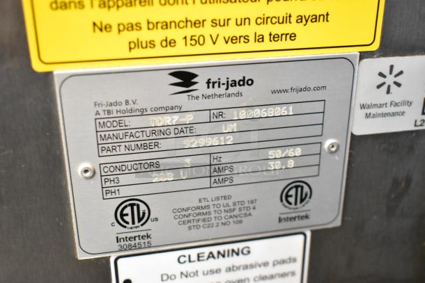 Fri-jado TDR7-P stainless steel commercial rotisserie oven label; mentions 208 volts, 3 phase, with visible model and part numbers.