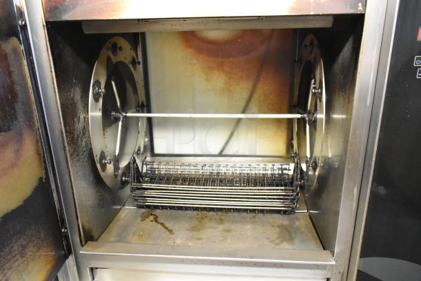 Fri-jado TDR7-P stainless steel electric rotisserie oven, commercial casters, 208V, 3-phase, floor style, used condition.