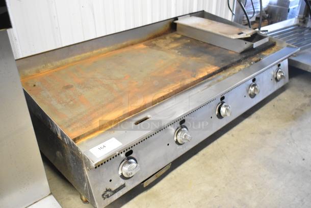 Star Ultra Max stainless steel commercial countertop gas griddle, showing signs of wear, five control knobs, label "164".