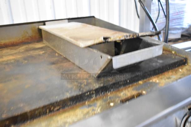 Star Ultra Max Stainless Steel Gas Griddle, countertop model, visible wear, ideal for commercial cooking needs.