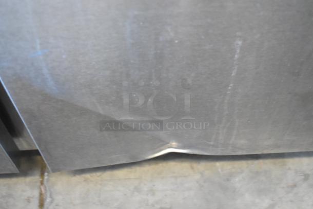 Traulsen TD078HT-ZSC01 stainless steel seafood display case, floor style, 115V, visible dent on lower panel.