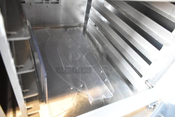 Traulsen TD078HT-ZSC01 stainless steel commercial seafood display case interior, floor style, 115V, 1-phase.
