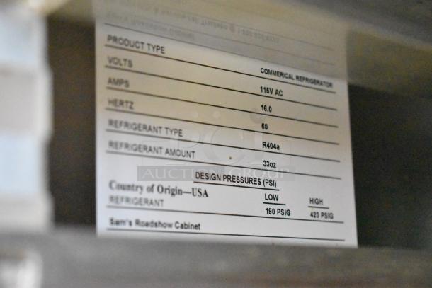 Traulsen TD078HT-ZSC01 seafood display case label showing specs: 115V AC, 16 Amps, R404a refrigerant, USA origin.