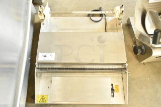 Metal countertop sealing station, 115 volts, 1 phase, with visible control panel and power cord. Auction tag 166.