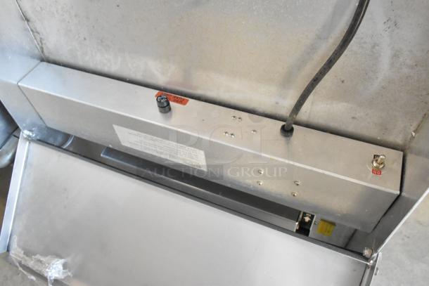 Metal countertop sealing station, 115 volts, 1 phase, silver finish, visible wiring and switch, used condition.