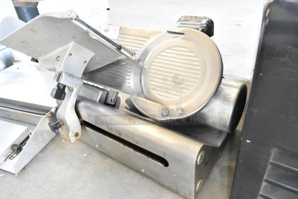 Globe stainless steel commercial meat slicer with blade sharpener, 115 volts, 1 phase. Number 167 tag visible.