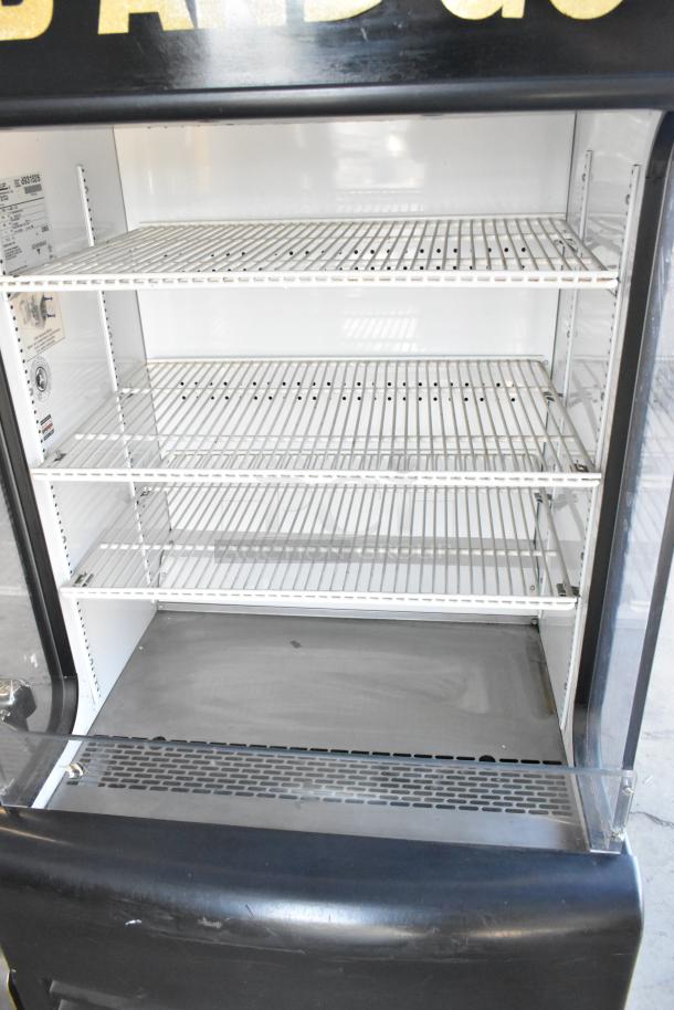 2017 True TAC-14GS-LD open merchandiser; metal frame, 115V, 1 phase; good condition with visible shelving and control panel.