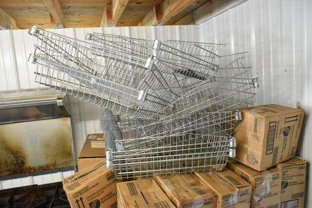 97 items including stacked metal baskets and boxes labeled "Diversified Chemical Tech Oven Shield." Good condition.