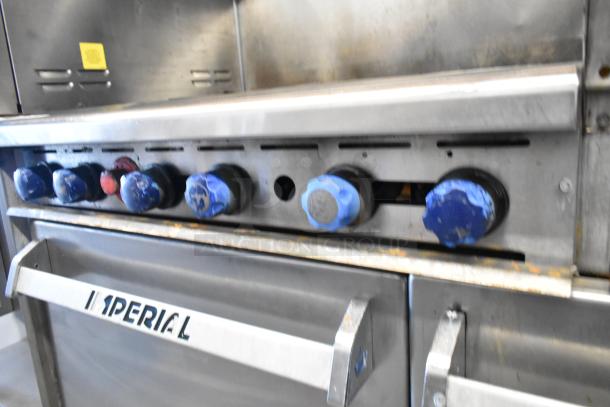 Imperial stainless steel commercial 6-burner gas range with right-side griddle, 2 ovens, over shelf, and backsplash.