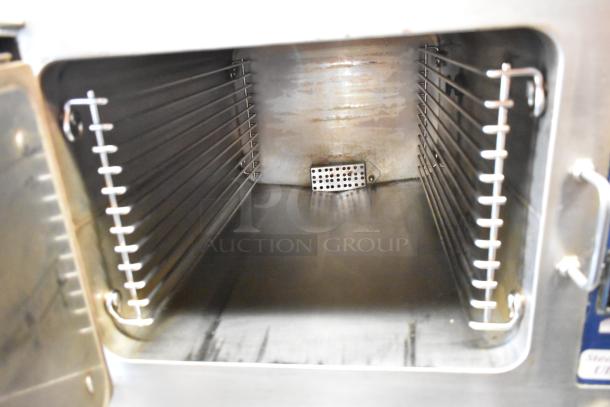 Cleveland 21CET8 SteamCraft Ultra 3 stainless steel steam cabinet interior, showing clean racks and chamber.