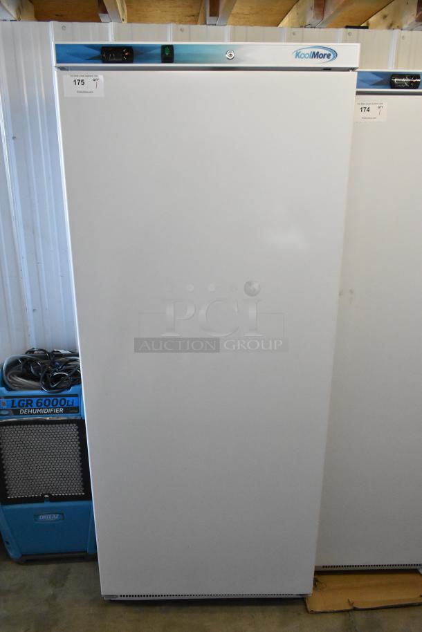 Brand new scratch and dent KoolMore KM-RMD20WH 20 Cu. Ft. commercial reach-in refrigerator, 115V, 1 phase, with visible label.
