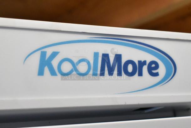 KoolMore logo on reach-in refrigerator, model KM-RMD20WH, new condition with minor scratches, 115V, 1 phase, 20 Cu. Ft.