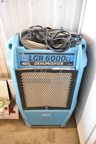 Drieaz LGR 6000Li dehumidifier, blue, 115 volts, 1 phase, in good condition with visible cords on top.