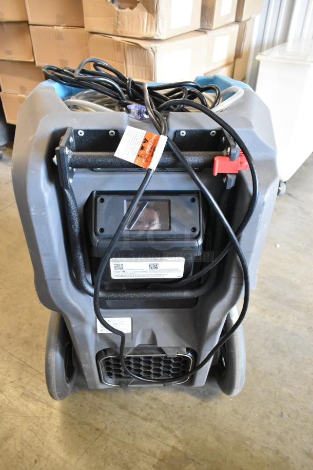 Drieaz LGR 6000Li dehumidifier, 115 volts, 1 phase, durable gray casing, visible cords and labels, excellent condition.