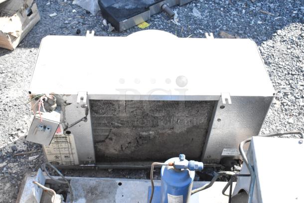Kolpak compressor and evaporator fan unit with visible wear, showing model and specification labels, for a walk-in box system.