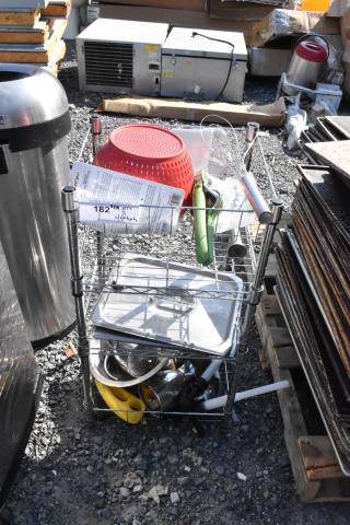 Chrome wire shelving unit with stainless steel lids, colander, and tools. Visible tag indicates buyer must dismantle.