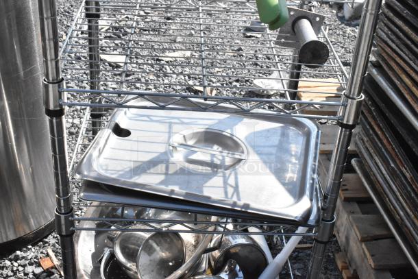Chrome wire shelving unit with stainless steel lids and colander; buyer must dismantle; freight charges apply.