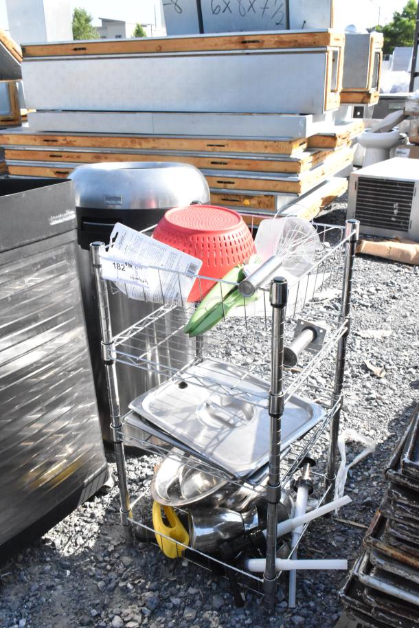 Chrome finish wire shelving unit with stainless steel lids, red colander, and kitchen contents. Buyer to dismantle.