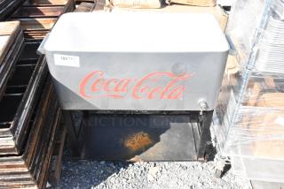 Coca Cola Poly Portable Ice Bin with branded logo, in good condition. Features drainage spout and sturdy black stand.