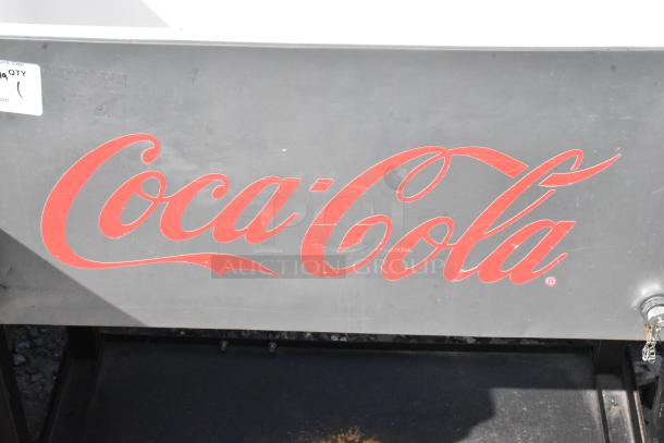 Coca Cola Poly Portable Ice Bin with logo, sturdy design, moderate wear. Ideal for outdoor events and collectors.